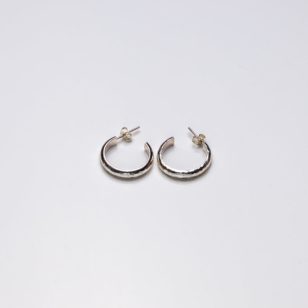 Hammered sterling silver hoop earrings by Purple Butterfly Studios